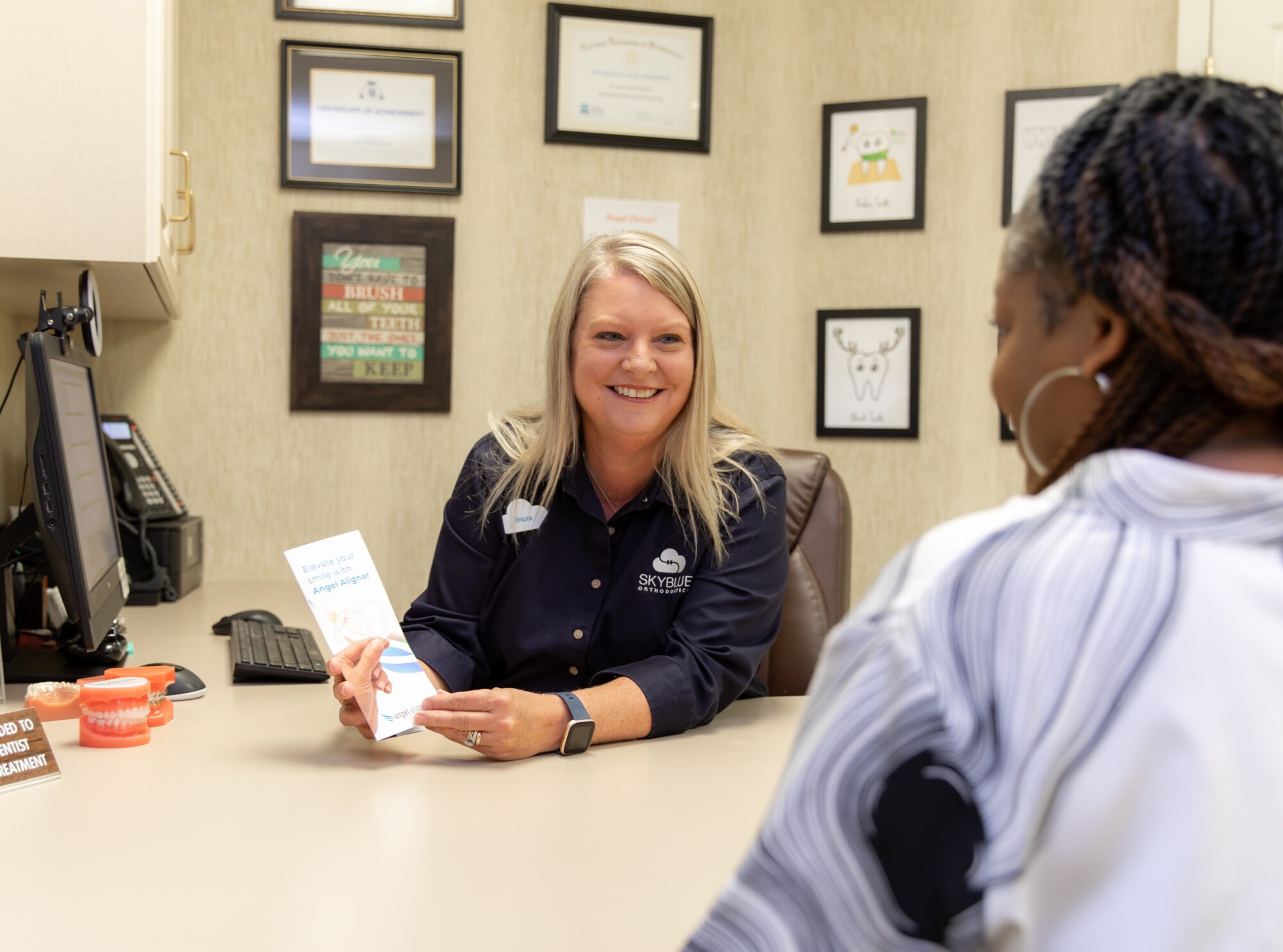 Dr. Barnes and a patient at Skyblue Orthodontics smiling