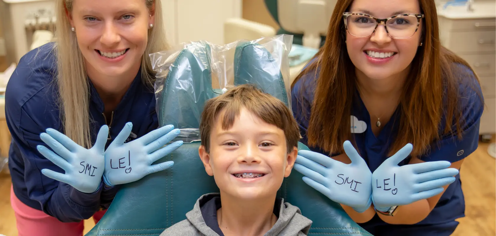 Dr. Barnes and a hygienist with an orthodontic patient